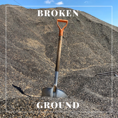 Photo of a shovel breaking ground.