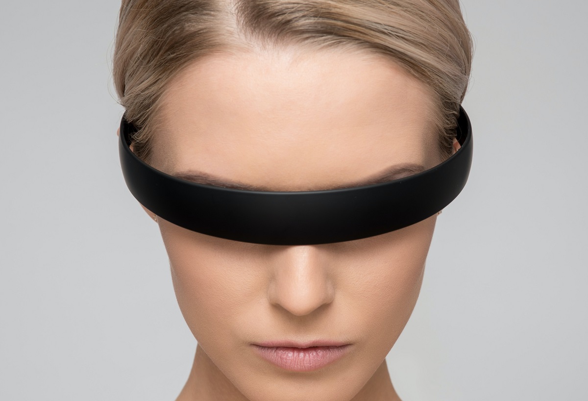 A woman wearing virtual reality glasses.